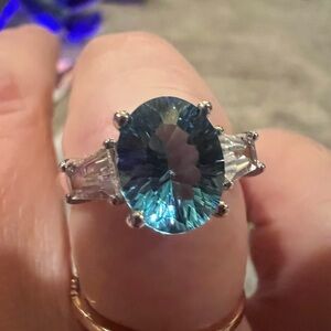 Elegant Blue Topaz and White gold Ring